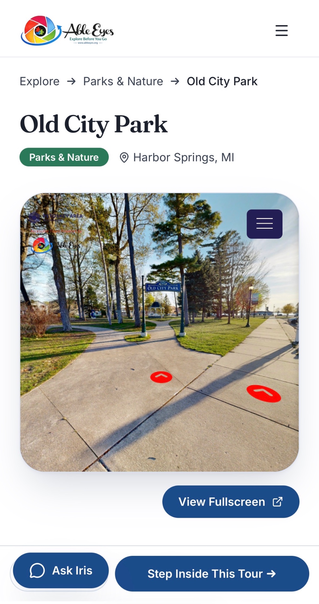 Able Eyes tour of Old City Park in Harbor Springs, Michigan, showing a paved path leading to the park sign and gazebo.